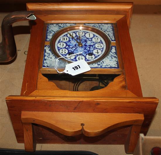 Pine-cased wall clock with glazed tile face